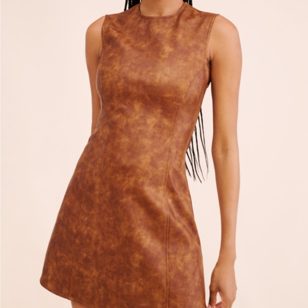 We wore what Brown leather muscle tank dress